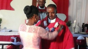 wife congratulationing Pastor Makaro