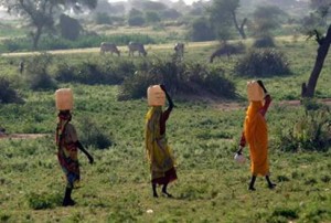 ladies carrying water